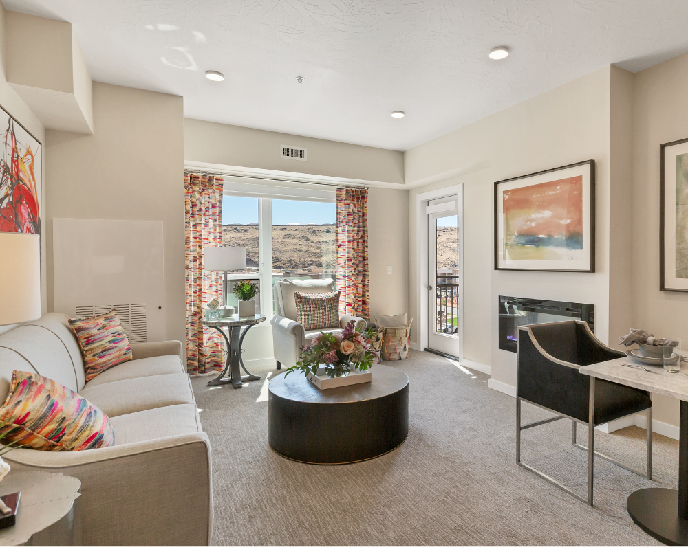 living room withina unit of The Ovation by avamere at sienna hills Continuing Care Retirement Community in washington city utah